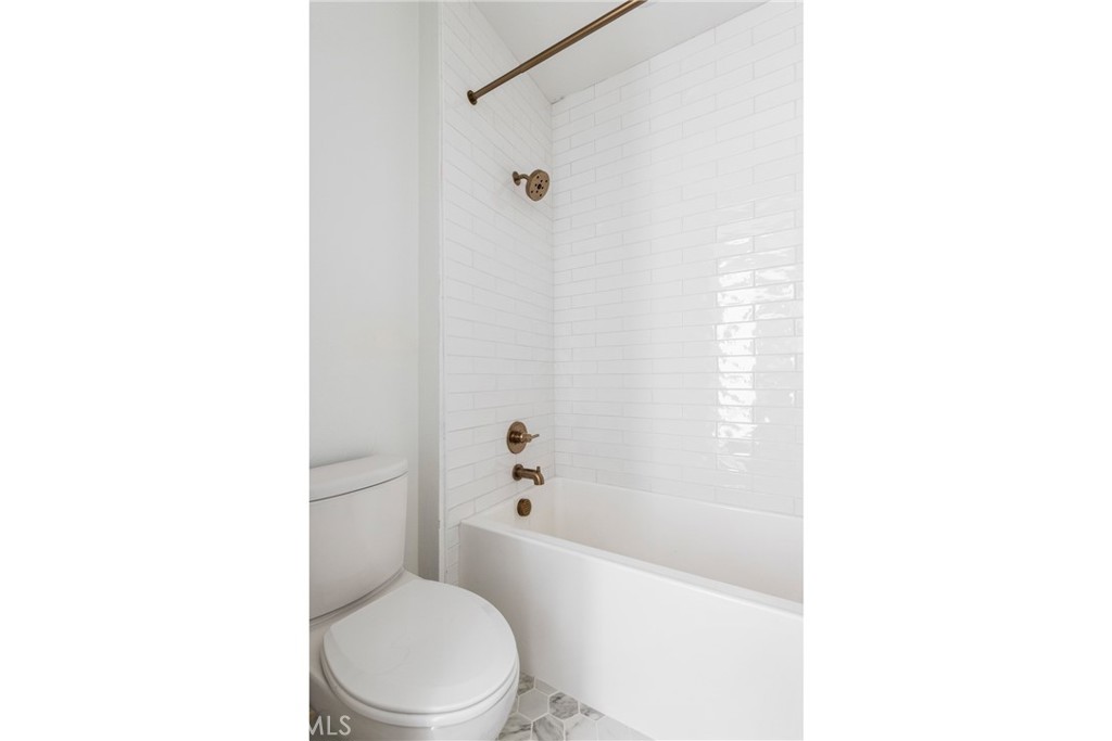 175 East Palm Street Altadena, CA 91001 - Photo 22 of 22 a white toilet sitting next to a bath tub