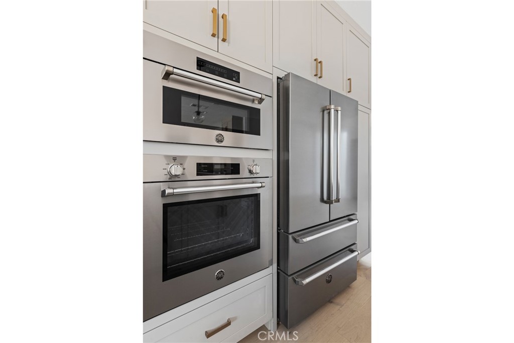 175 East Palm Street Altadena, CA 91001 - Photo 5 of 22 a kitchen with cabinets and stainless steel appliances