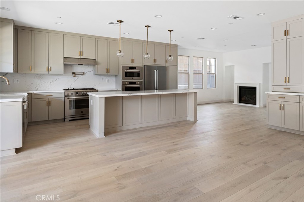 175 East Palm Street Altadena, CA 91001 - Photo 8 of 22 a large kitchen with cabinets and stainless steel appliances