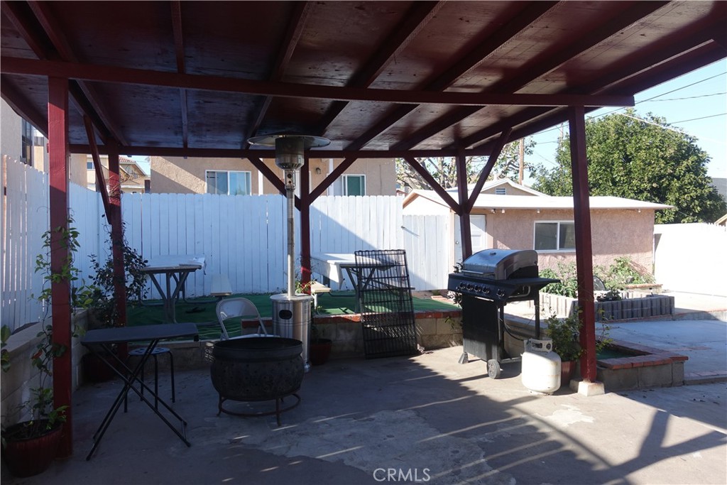 622 West 2nd Street San Pedro, CA 90731 - Photo 18 of 42 a view of a porch with furniture and a grill
