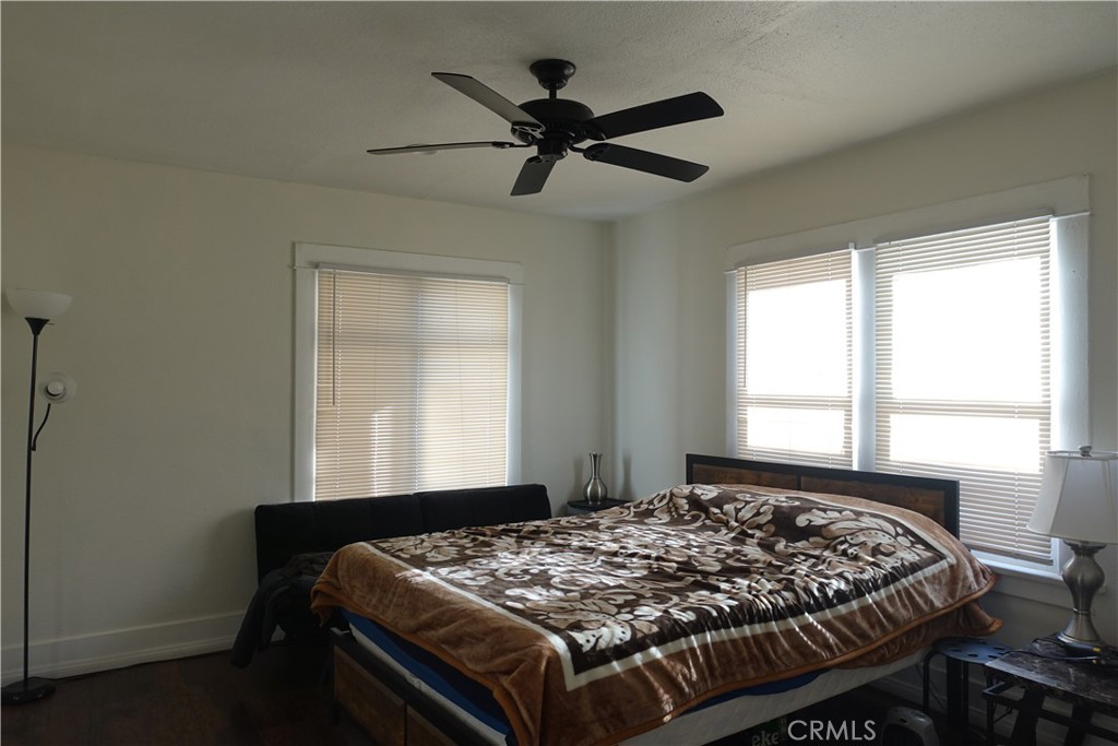 622 West 2nd Street San Pedro, CA 90731 - Photo 2 of 42 a bed sitting in a bedroom next to a window