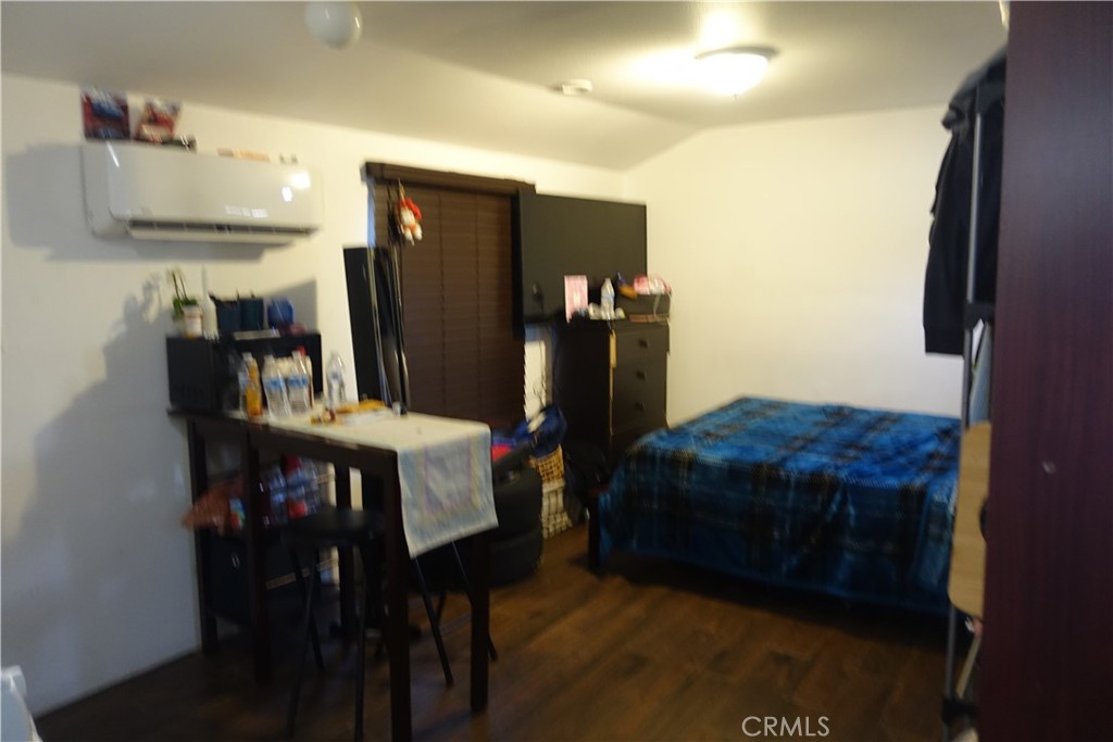 622 West 2nd Street San Pedro, CA 90731 - Photo 28 of 42 a bed room with a bed and a refrigerator