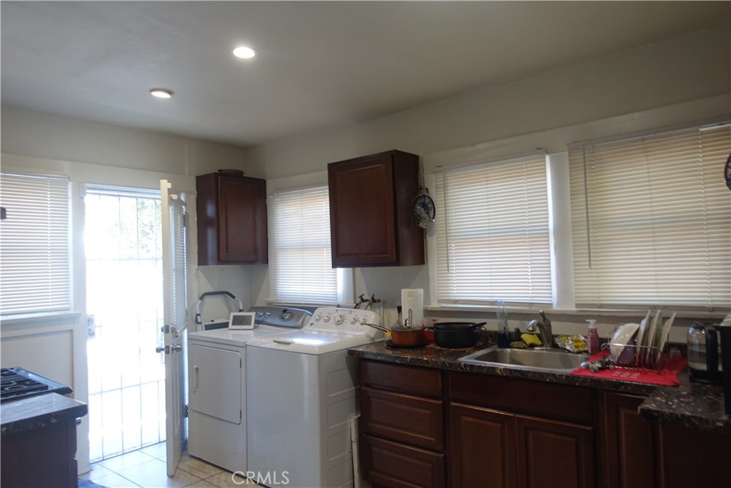 622 West 2nd Street San Pedro, CA 90731 - Photo 3 of 42 a kitchen with a sink stove and cabinets