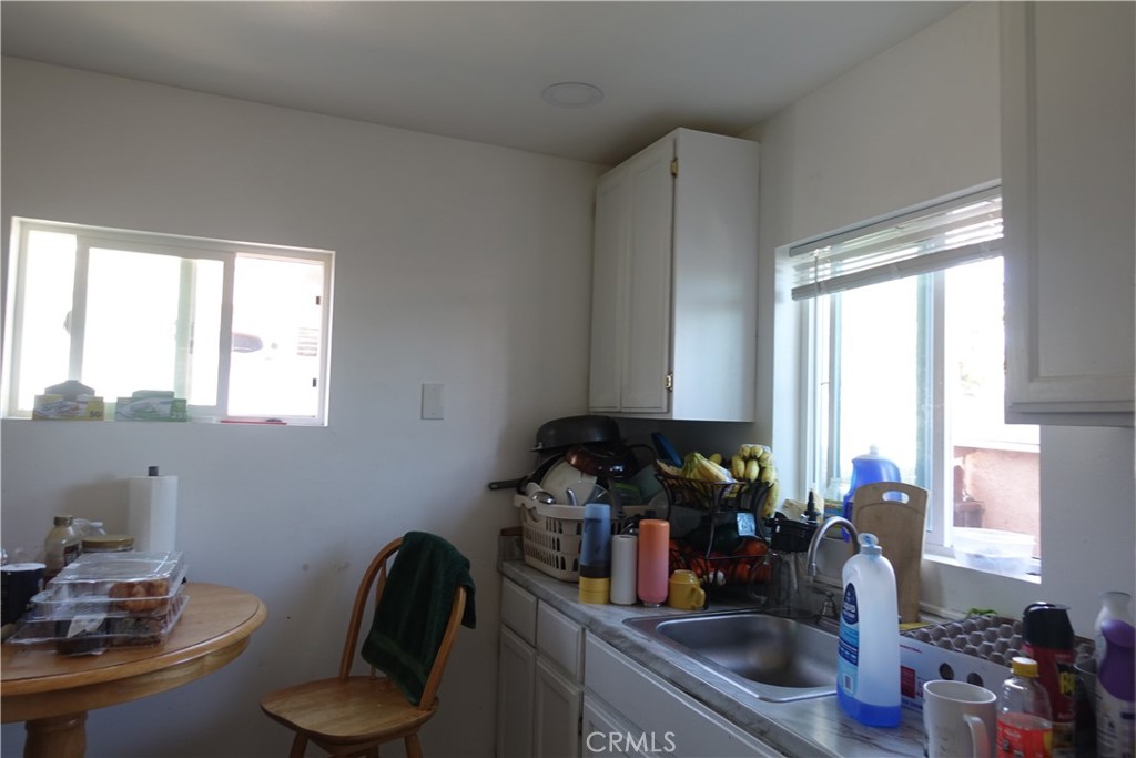 622 West 2nd Street San Pedro, CA 90731 - Photo 36 of 42 a kitchen with a sink appliances and cabinets