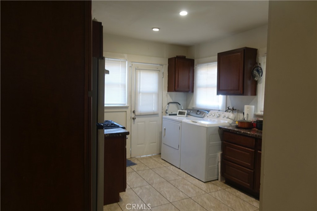 622 West 2nd Street San Pedro, CA 90731 - Photo 7 of 42 a kitchen with a sink and cabinets