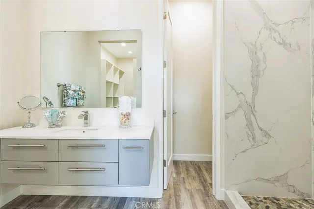 a bathroom with a sink and a mirror