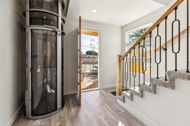a view of an entryway with wooden floor