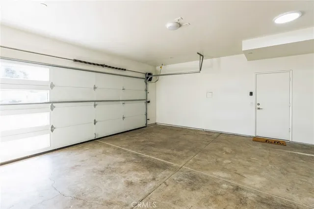 a view of hallway with wooden floor