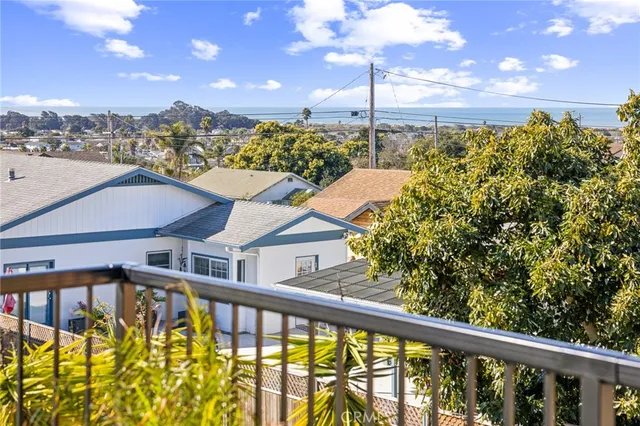 a view of a balcony with yard