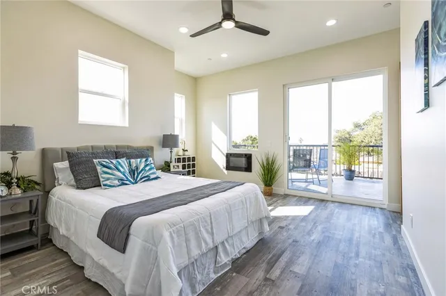 a bedroom with a large bed and a large window