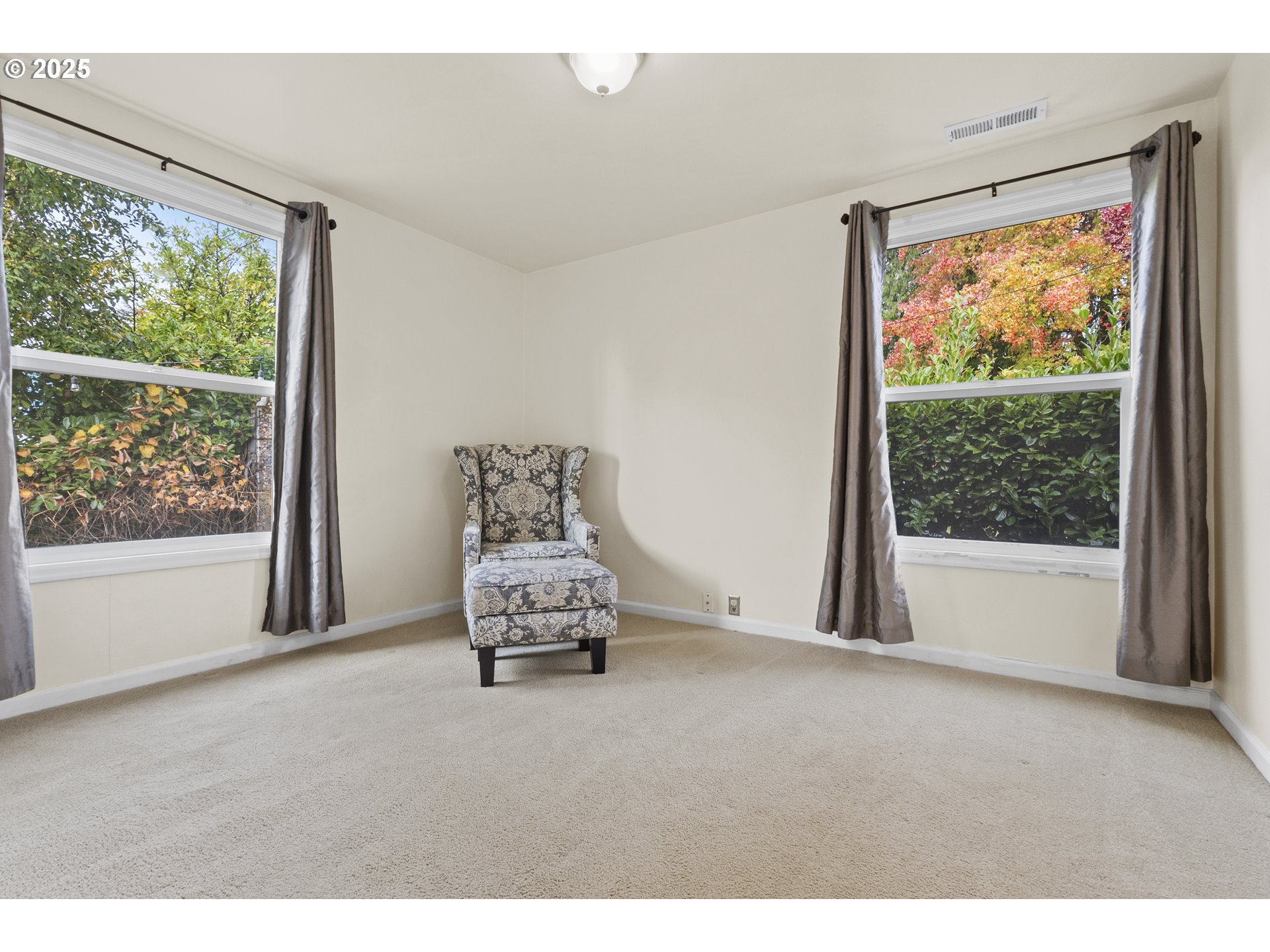 707 Wynooski Street Newberg, OR 97132 - Photo 4 of 12 a living room with furniture and a large window