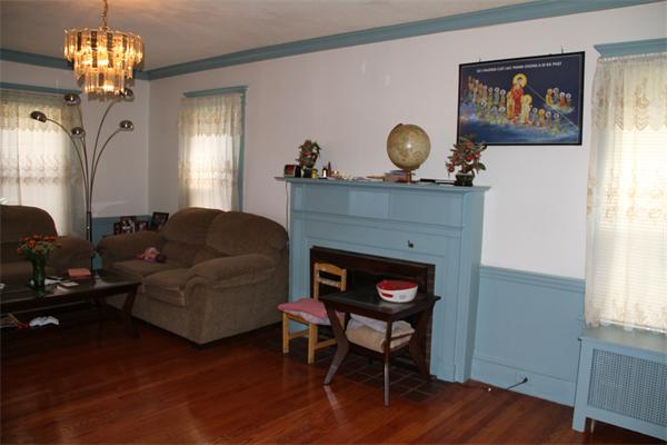 34 Herman Street Springfield, MA 01108 - Photo 4 of 6 a living room with furniture and a fireplace
