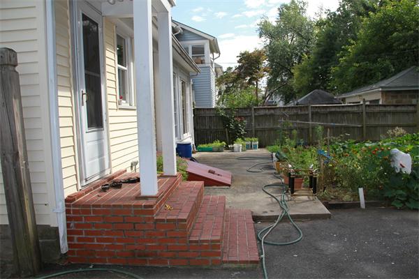 34 Herman Street Springfield, MA 01108 - Photo 6 of 6 a view of backyard with outdoor seating and plants
