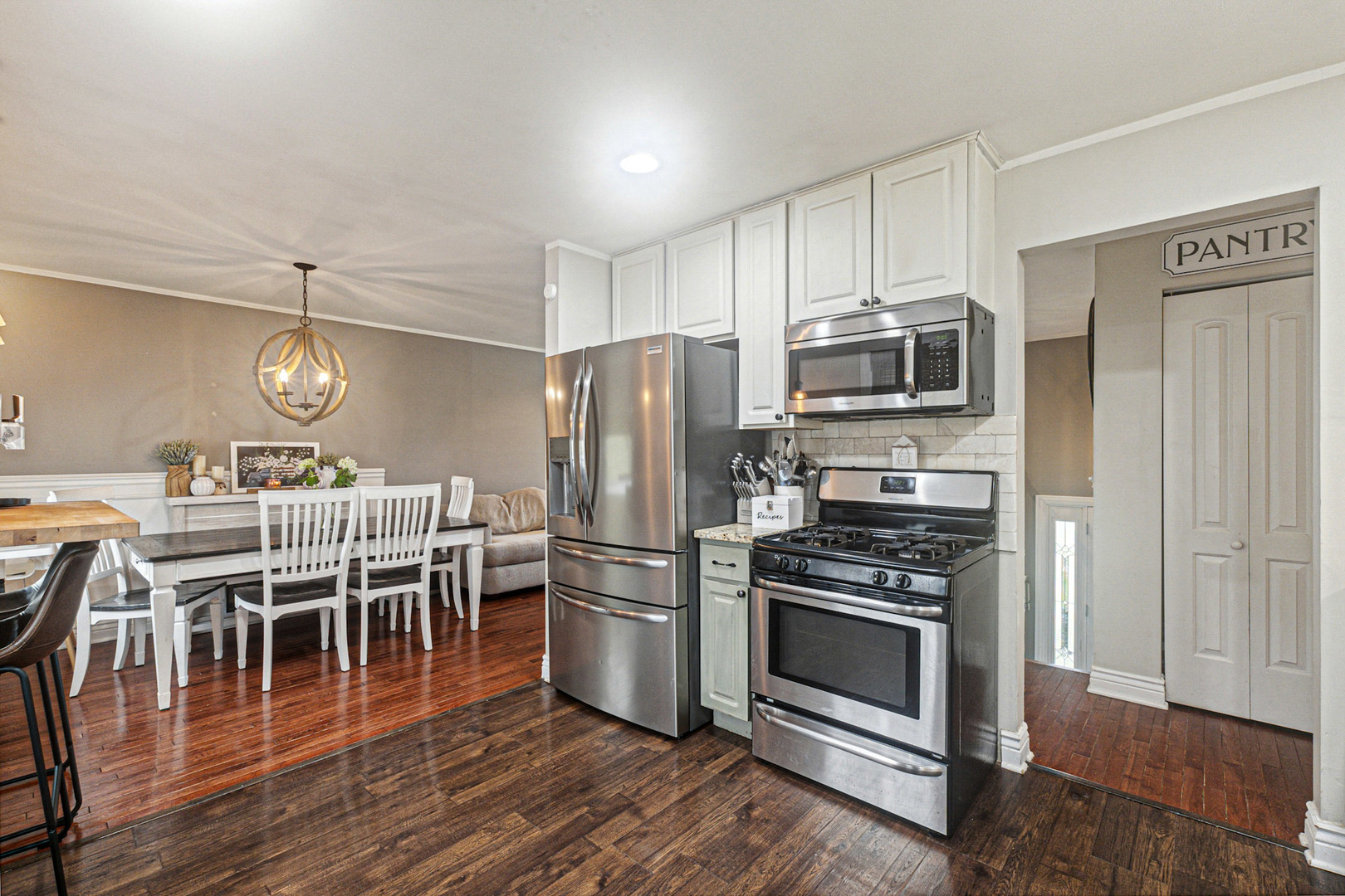 2016 Digby Drive New Lenox, IL 60451 - Photo 8 of 26 a kitchen with wooden floors stainless steel appliances and cabinets