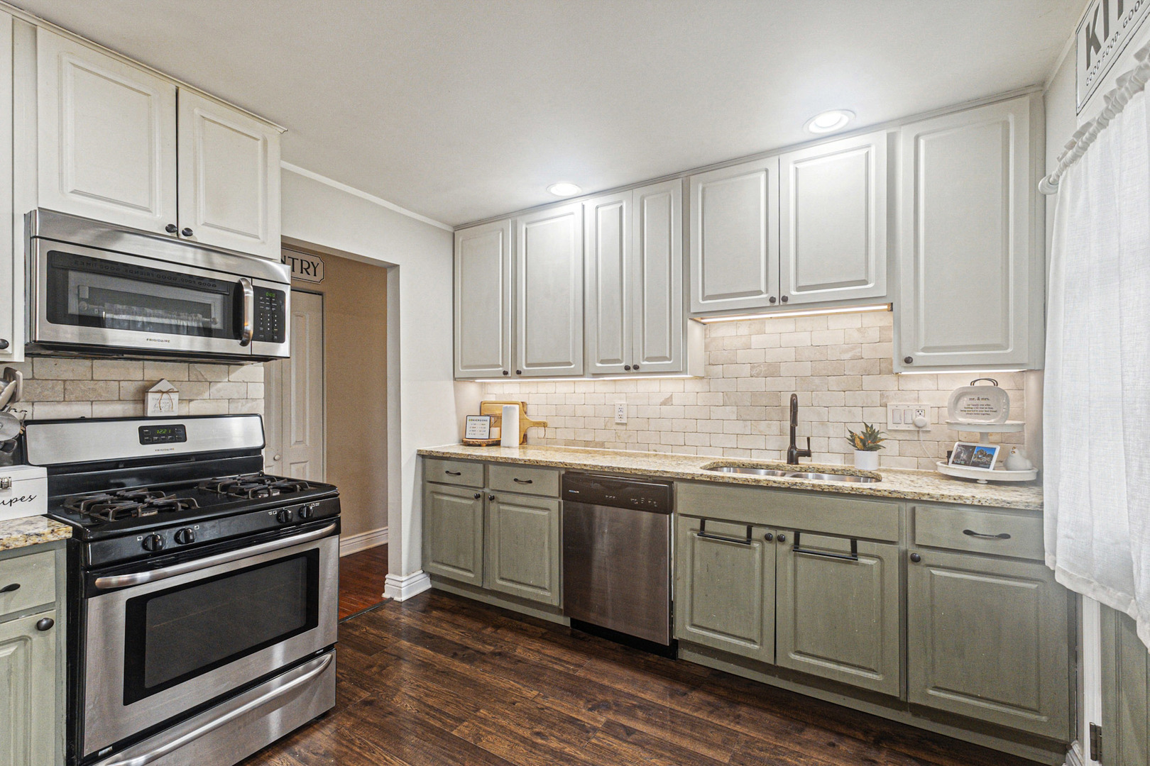 2016 Digby Drive New Lenox, IL 60451 - Photo 9 of 26 a kitchen with stainless steel appliances granite countertop a sink stove and refrigerator
