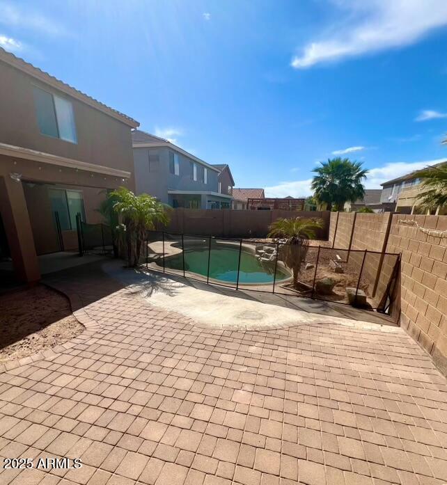 43578 West Cydnee Drive Maricopa, AZ 85138 - Photo 16 of 18 a backyard of a house with table and chairs