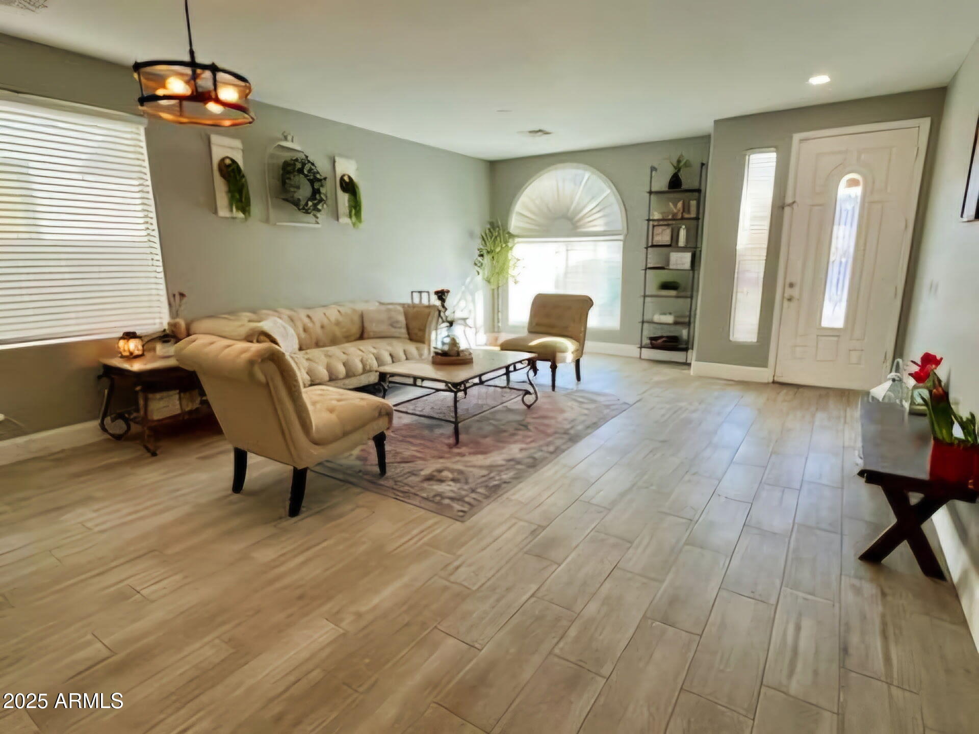 43578 West Cydnee Drive Maricopa, AZ 85138 - Photo 3 of 18 a living room with furniture and a wooden floor