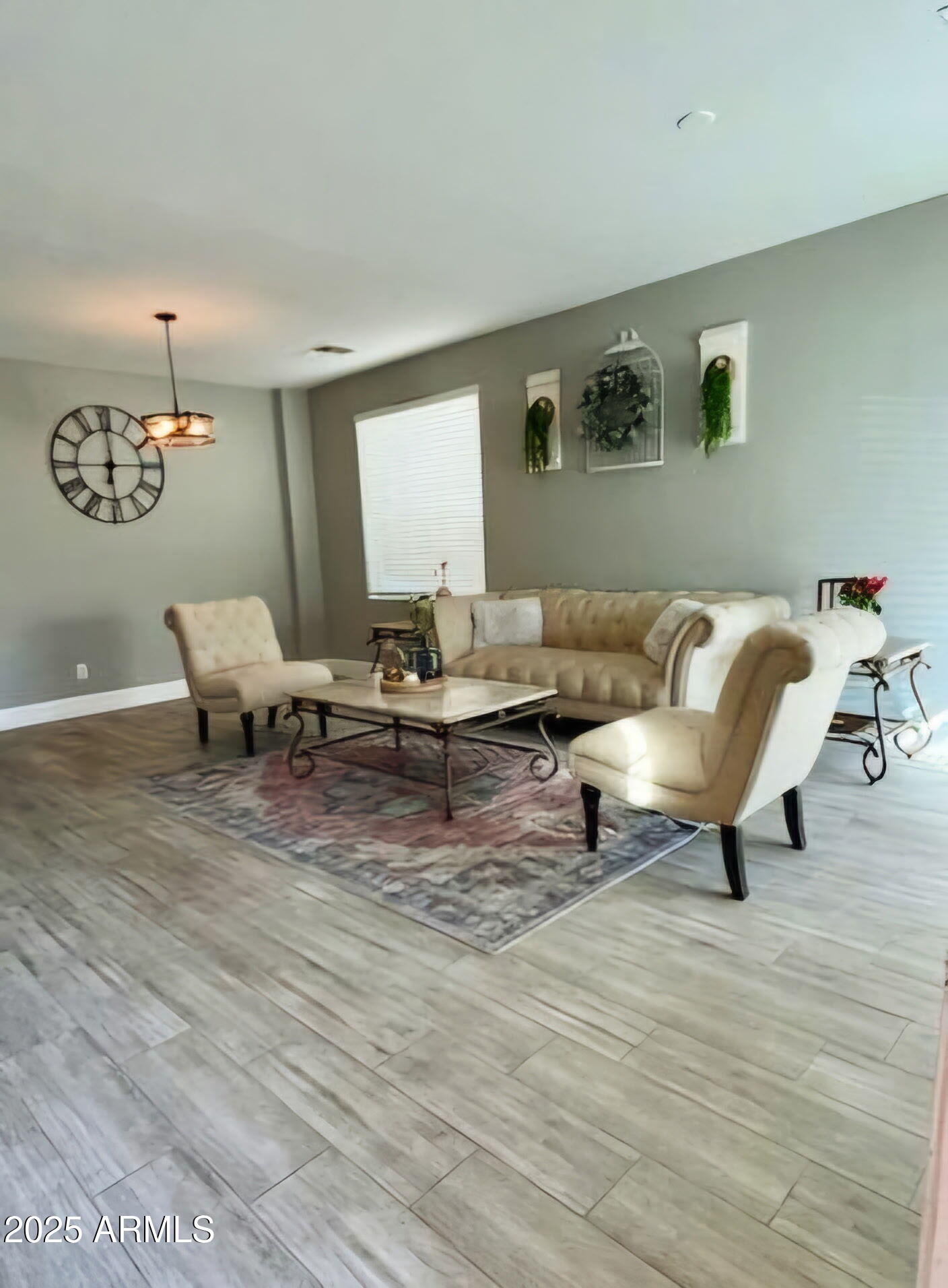 43578 West Cydnee Drive Maricopa, AZ 85138 - Photo 4 of 18 a living room with furniture and a wooden floor