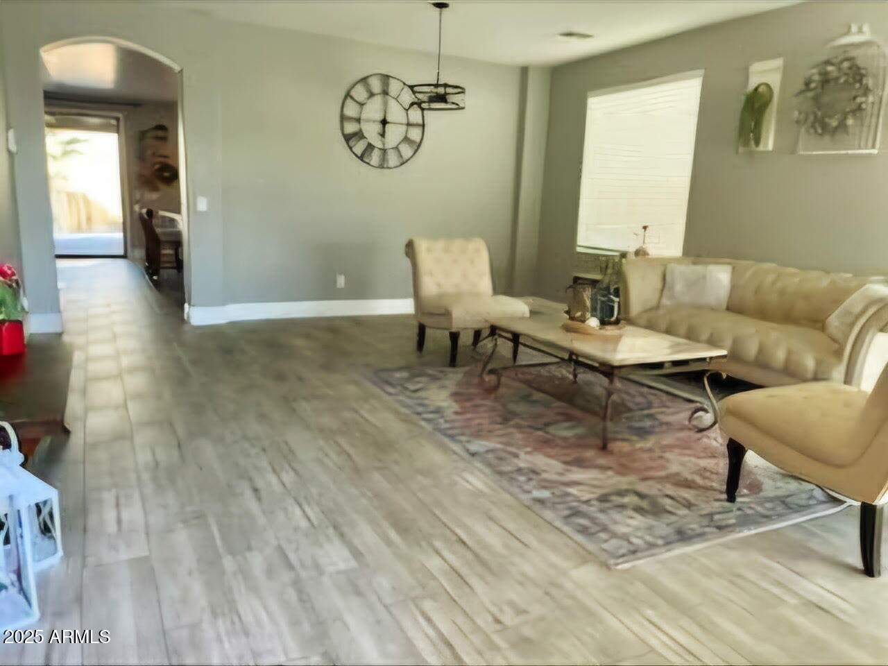 43578 West Cydnee Drive Maricopa, AZ 85138 - Photo 5 of 18 a living room with furniture and a table