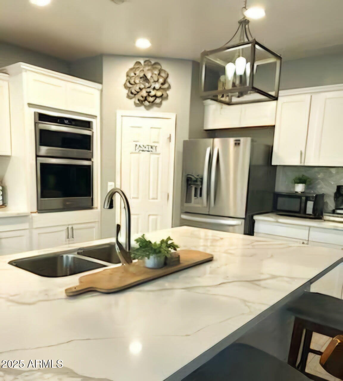 43578 West Cydnee Drive Maricopa, AZ 85138 - Photo 8 of 18 a kitchen with stainless steel appliances granite countertop a sink and a microwave