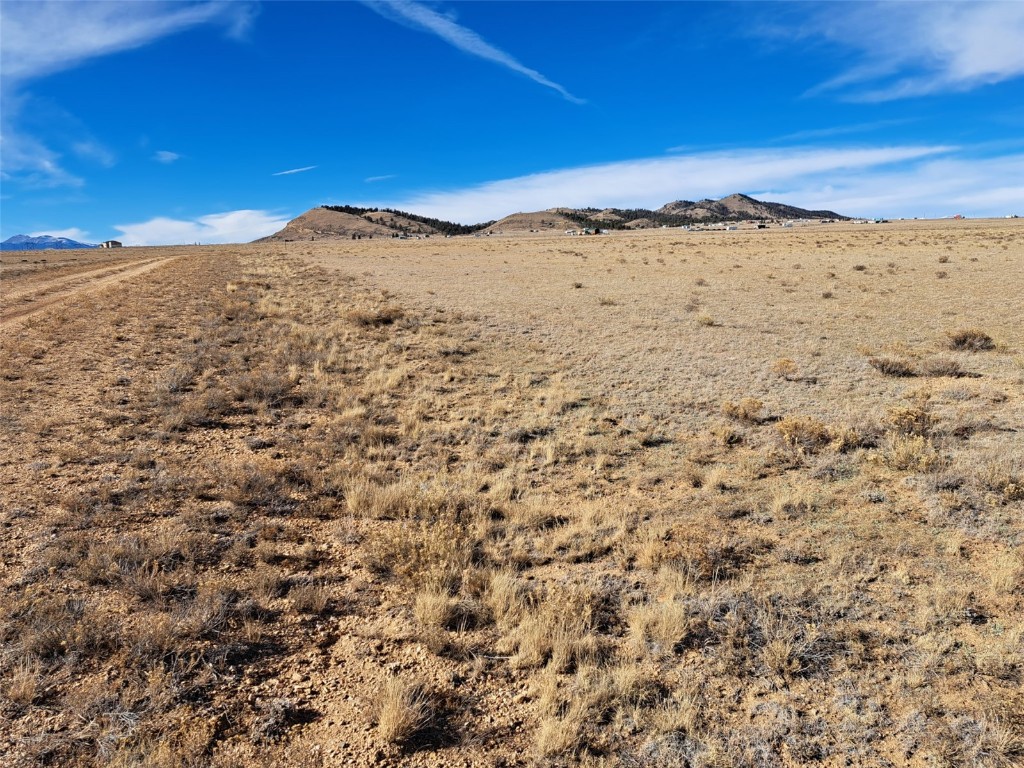 3547 Routt Road Hartsel, CO 80449 - Photo 2 of 22 a view of a large mountain with mountains in the background