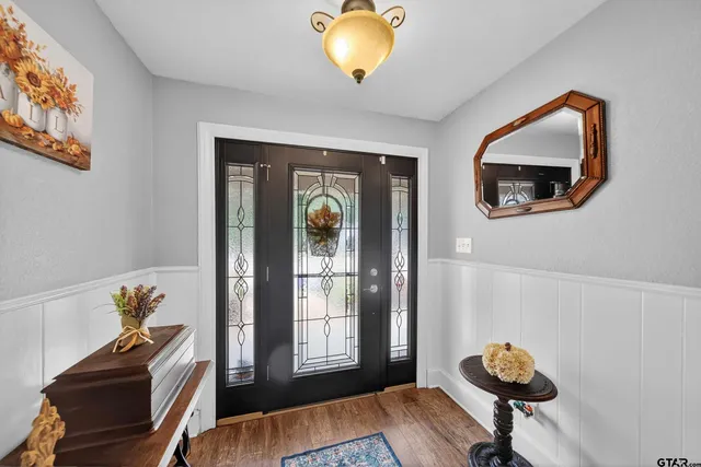 a view of a livingroom with furniture and a window