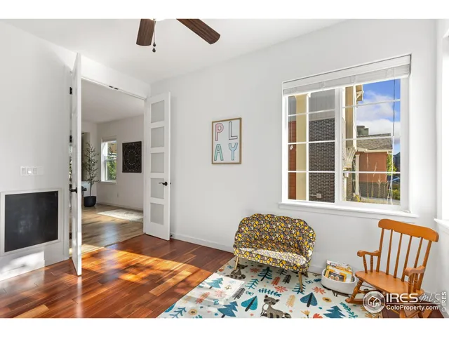 a view of a livingroom with furniture and hardwood floor