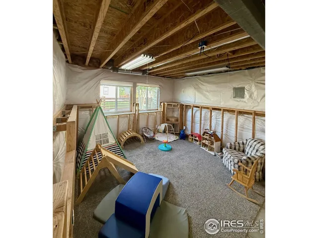 a view of a patio with table and chairs
