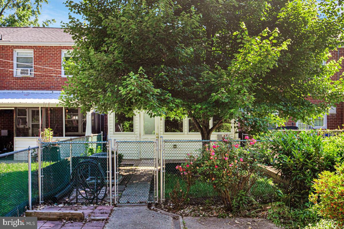 1016 Winsford Road Towson, MD 21204 - Photo 36 of 42 a view of backyard with table and chairs and potted plants