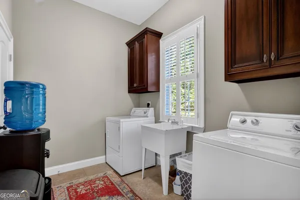 a room with a table chair and a window