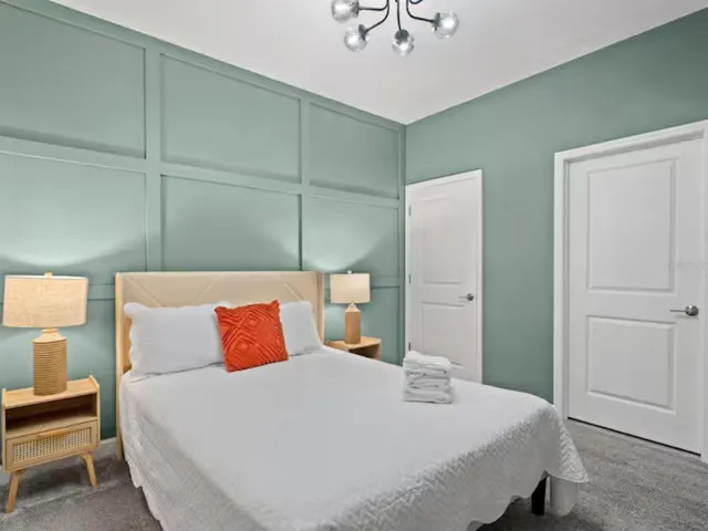 a bedroom with a bed and closet