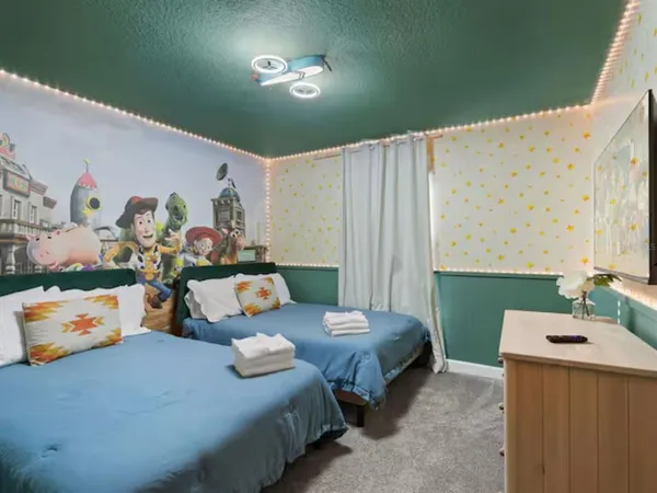 a bedroom with bed and window