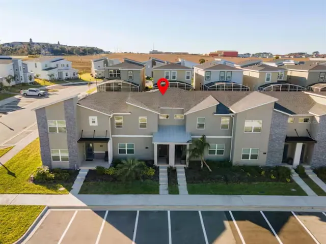 an aerial view of a residential apartment building with a glass door