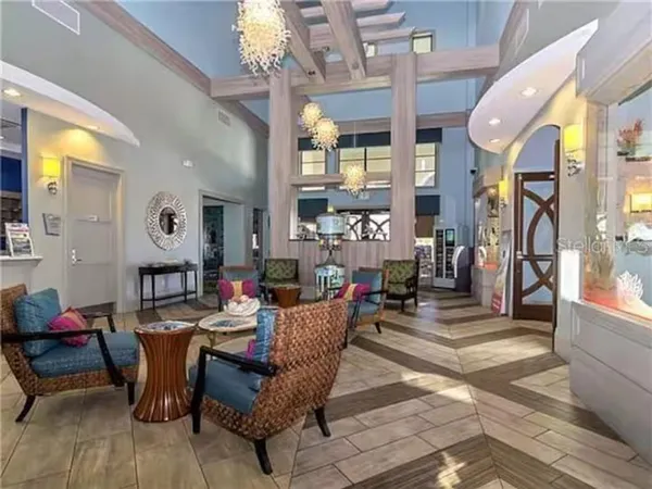 a view of a patio with table and chairs