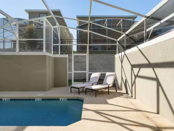 a view of a room with wooden floor and windows