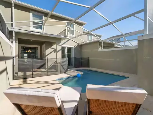 a view of a dining room with furniture and window