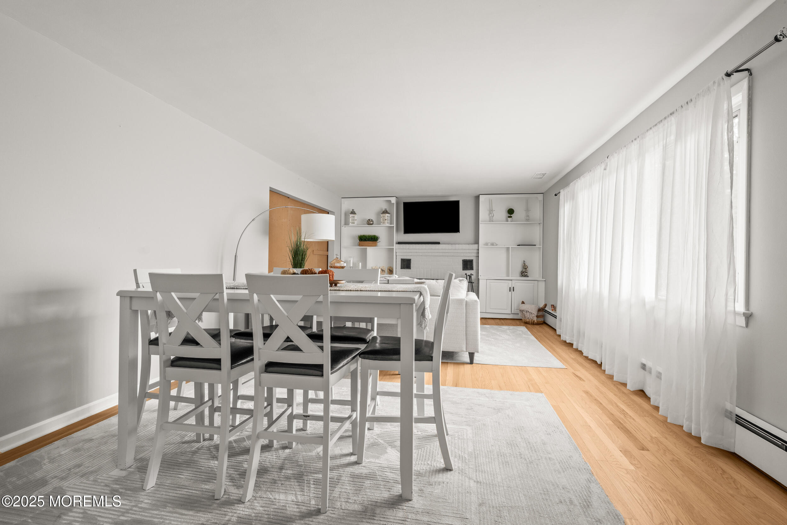 271 Jerome Avenue Oakhurst, NJ 07755 - Photo 11 of 39 a view of a dining room with furniture window and wooden floor
