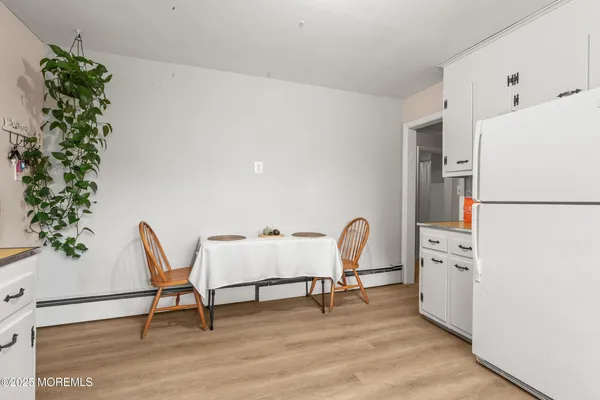 a workspace with furniture and a potted plant
