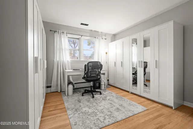 a white toilet sitting next to a shower