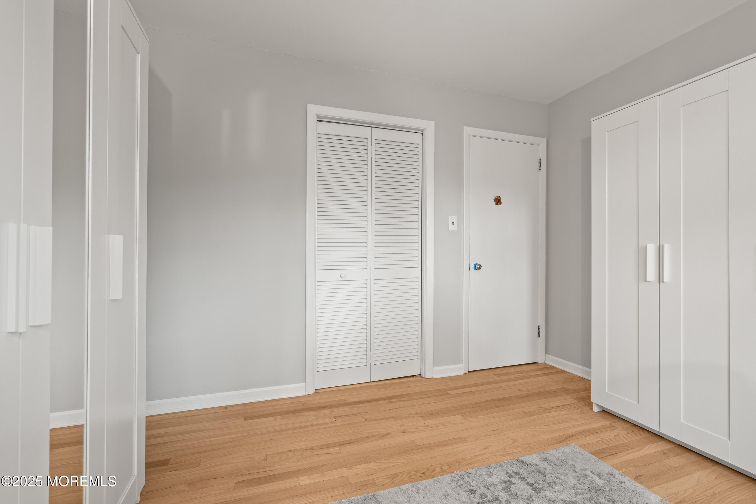 271 Jerome Avenue Oakhurst, NJ 07755 - Photo 17 of 39 a view of an empty room with wooden floor