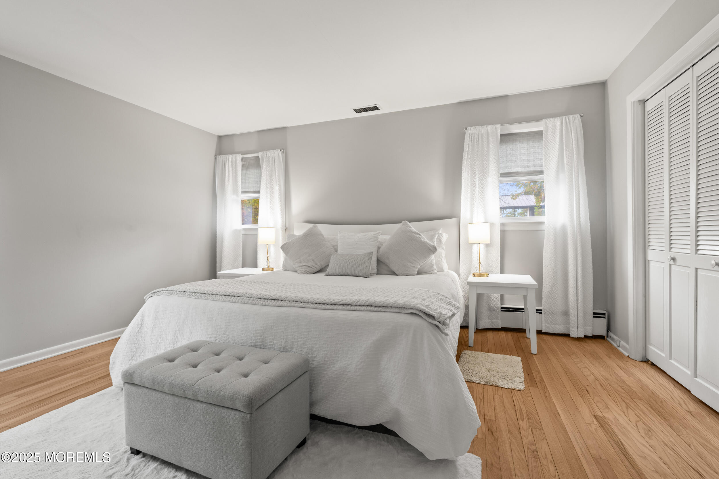 271 Jerome Avenue Oakhurst, NJ 07755 - Photo 20 of 39 a bedroom with a bed and a couch