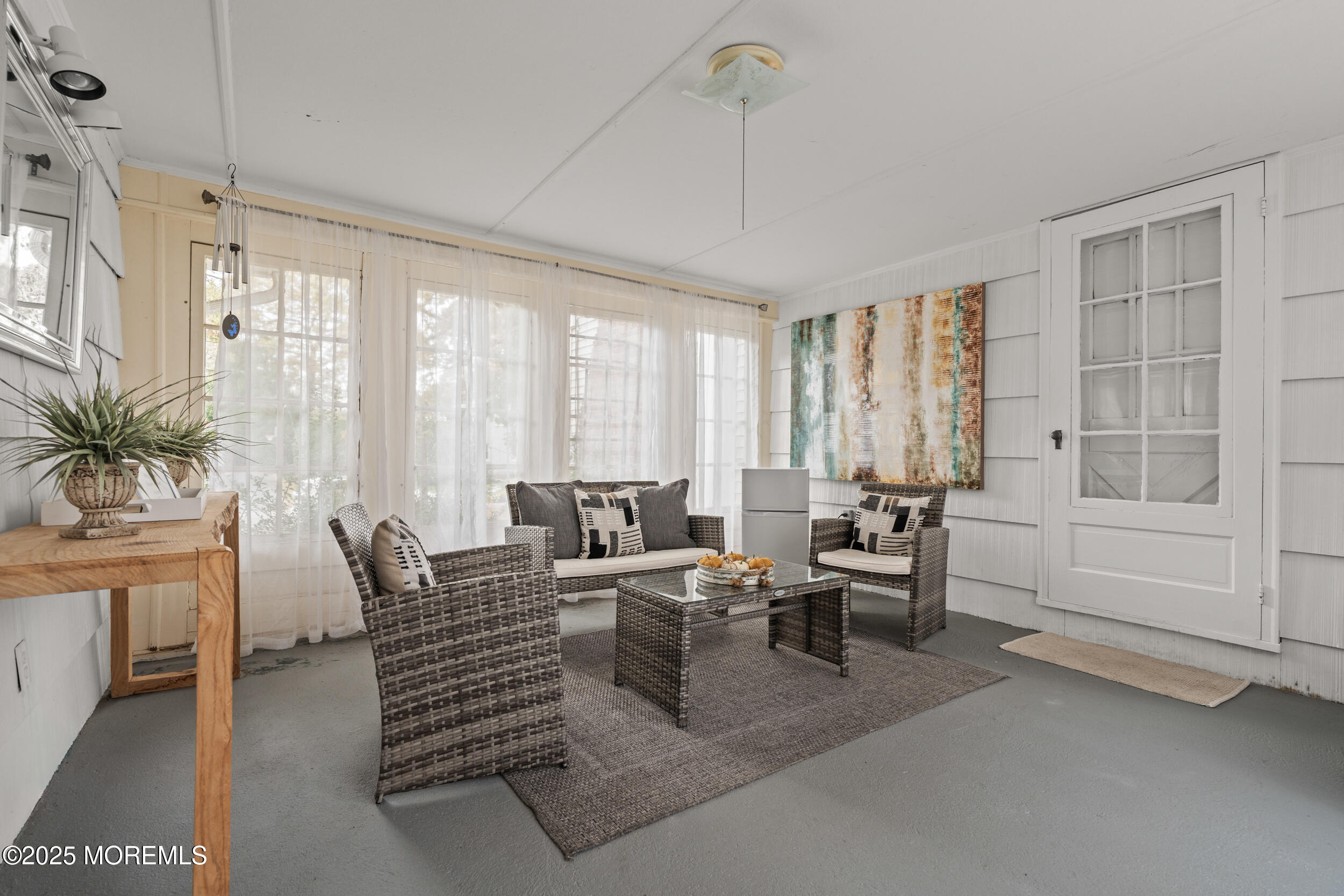 271 Jerome Avenue Oakhurst, NJ 07755 - Photo 5 of 39 a living room with furniture and large windows
