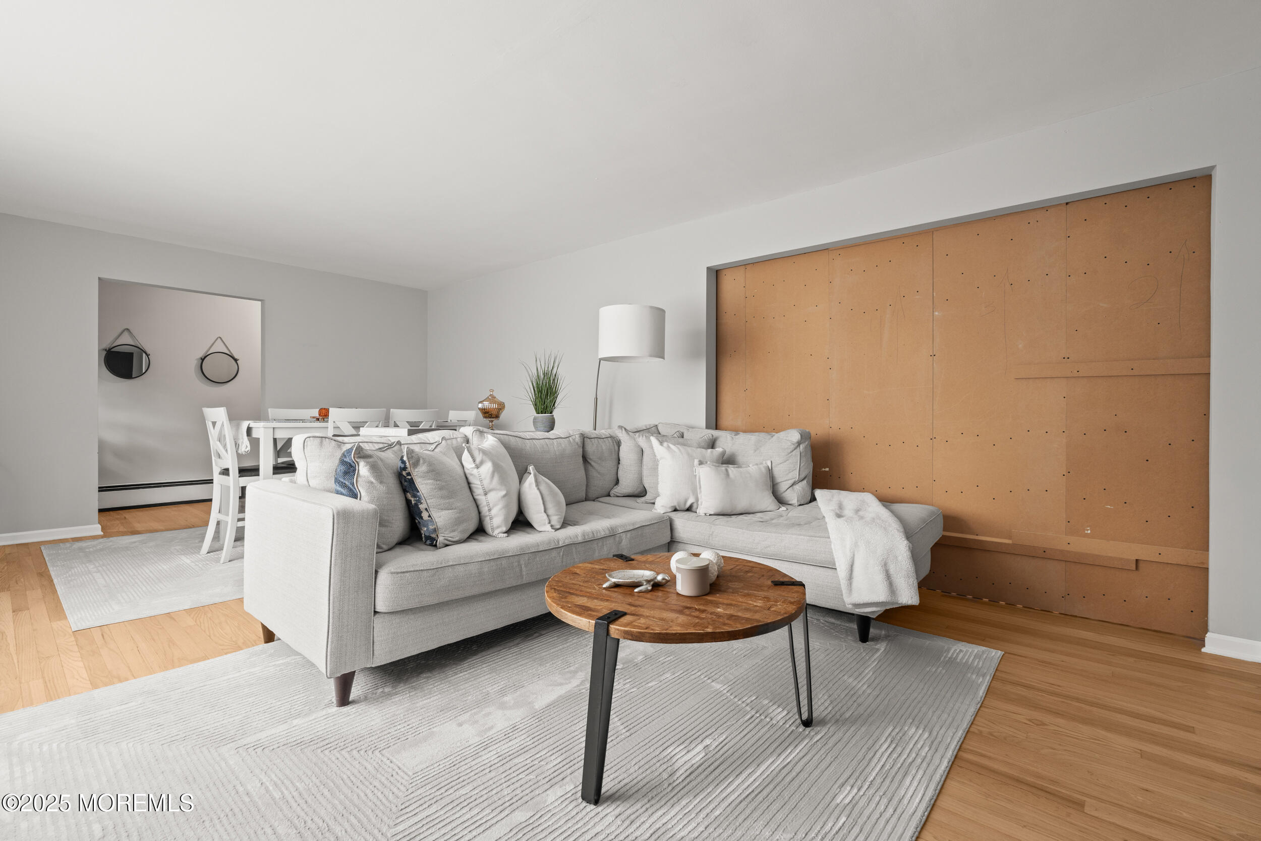 271 Jerome Avenue Oakhurst, NJ 07755 - Photo 7 of 39 a living room with furniture and a wooden floor