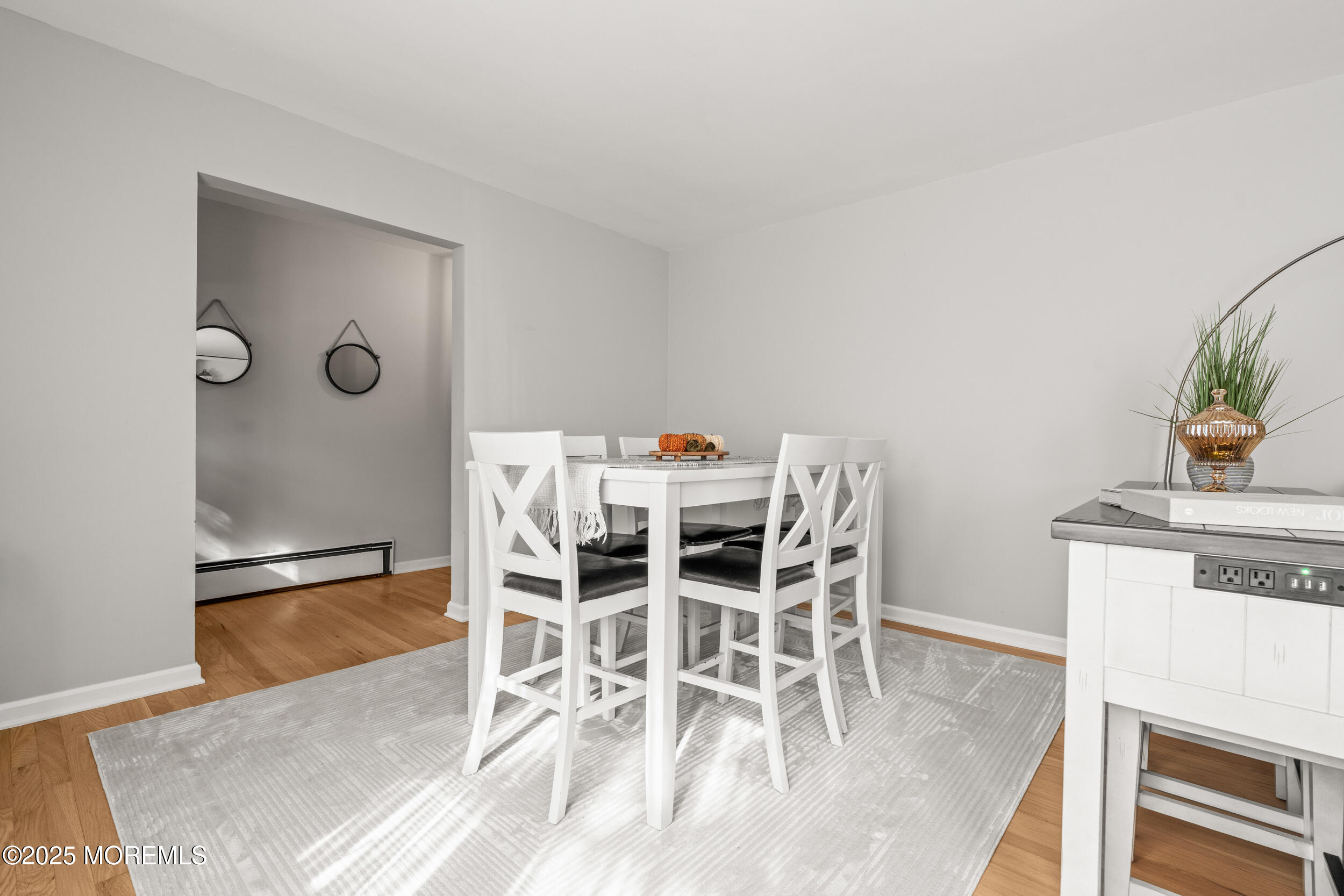 271 Jerome Avenue Oakhurst, NJ 07755 - Photo 10 of 39 a view of a dining room with furniture and wooden floor