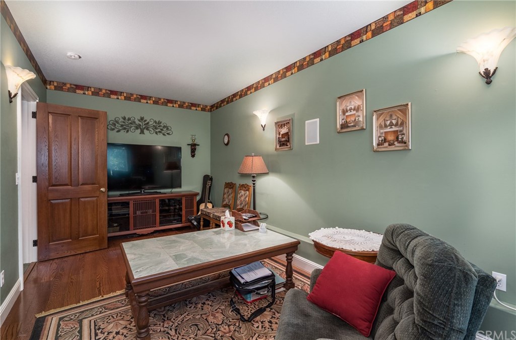 7703 Forest Drive Fish Camp, CA 93623 - Photo 25 of 48 a living room with furniture and a flat screen tv