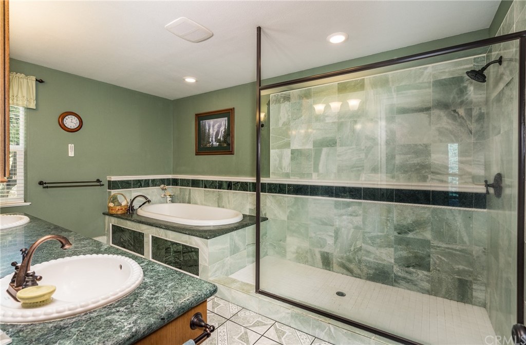 7703 Forest Drive Fish Camp, CA 93623 - Photo 35 of 48 a bathroom with a sink and a mirror