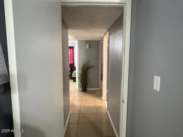 a view of a livingroom with furniture and a fan