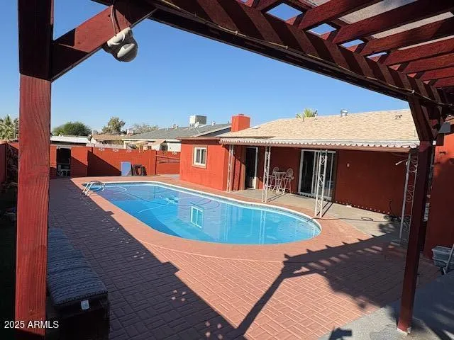 a view of a house with swimming pool