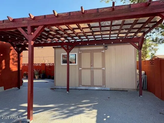 a backyard of a house with wooden floor and fence