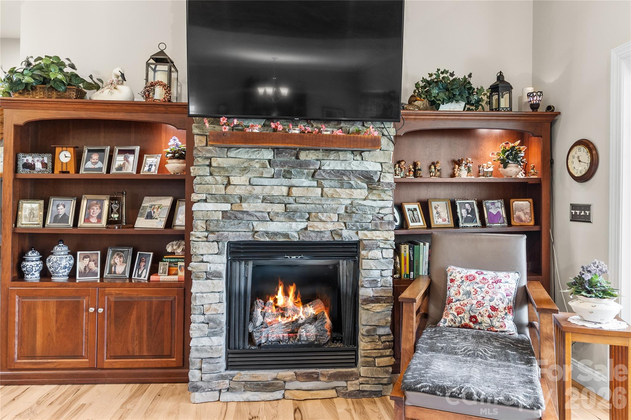 1103 River Ridge Way Lenoir, NC 28645 - Photo 14 of 46 a living room with lots of books and a fireplace